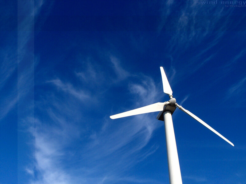 Wind turbine against blue sky