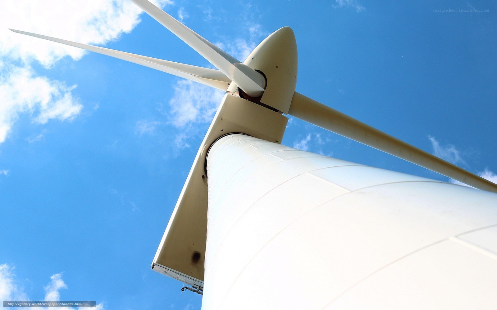 Wind turbine against blue sky