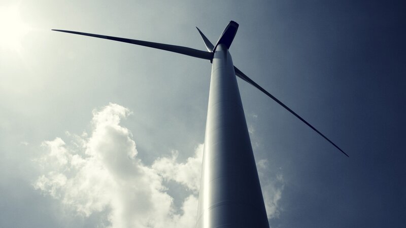 Wind turbine against sky