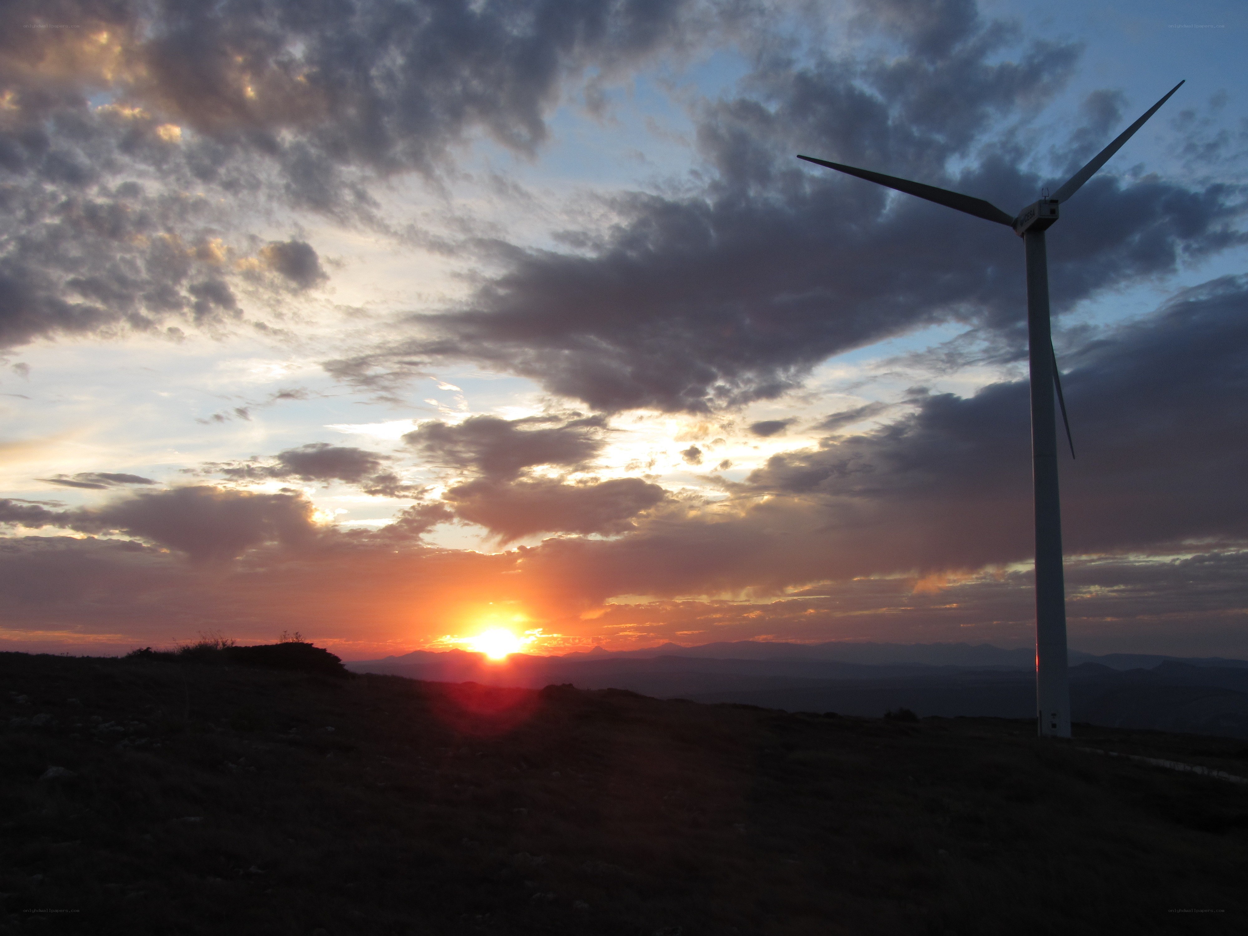 Wind turbine at sunset