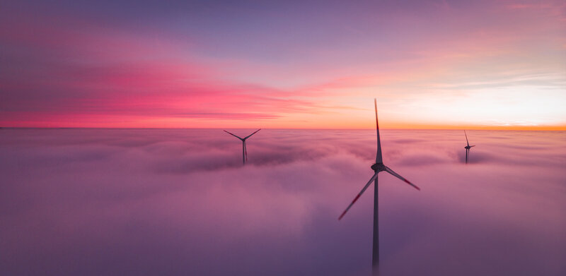 Wind Turbines Above Clouds — Purple