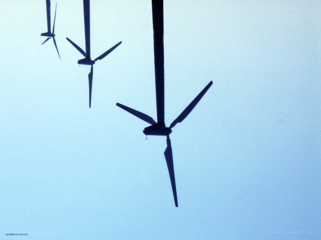 Wind turbines against blue sky