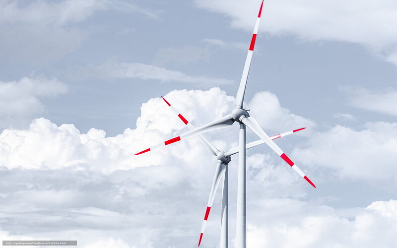 Wind turbines against cloudy sky