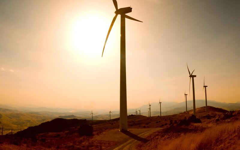 Wind turbines at sunset