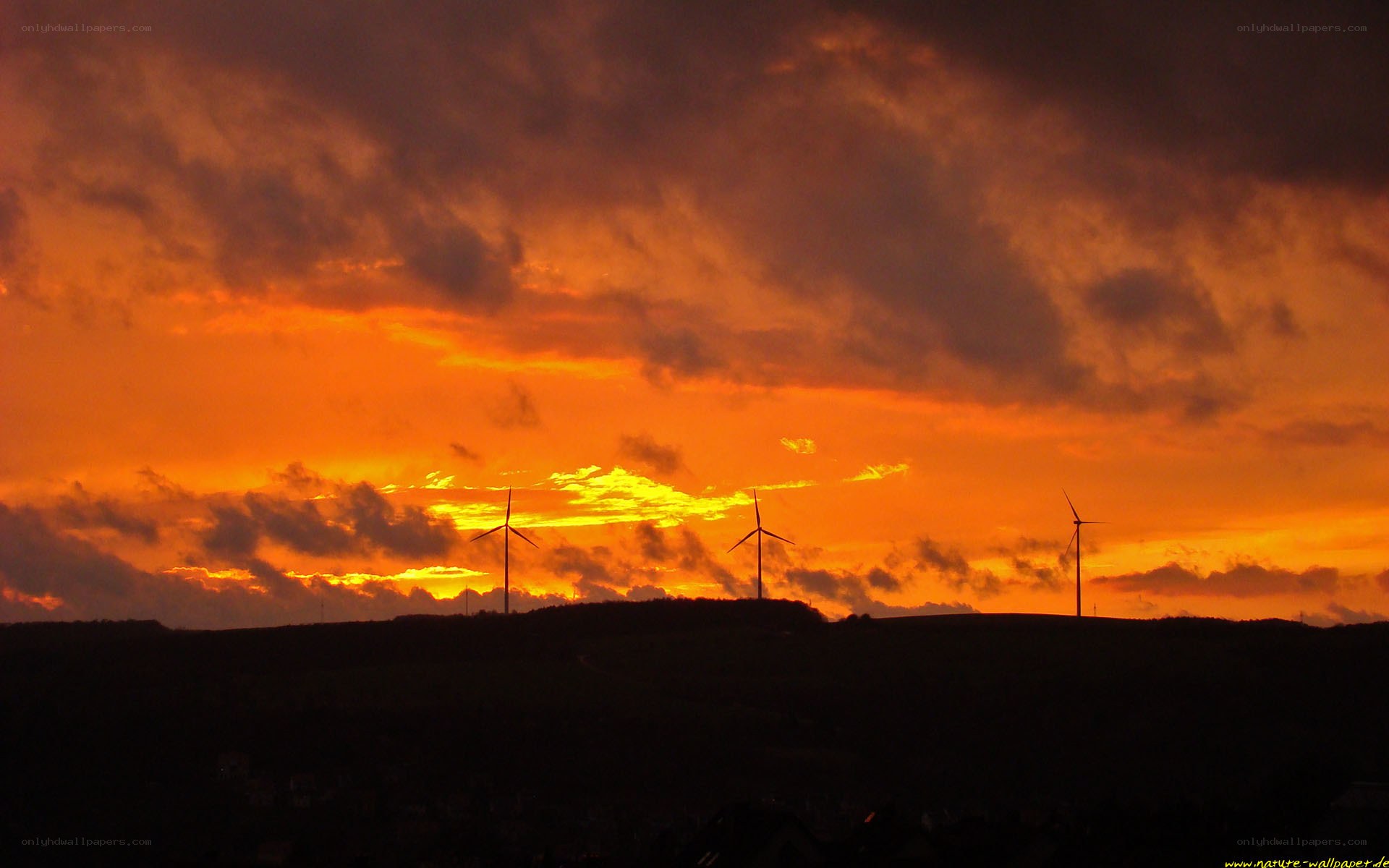 wind turbines at sunset