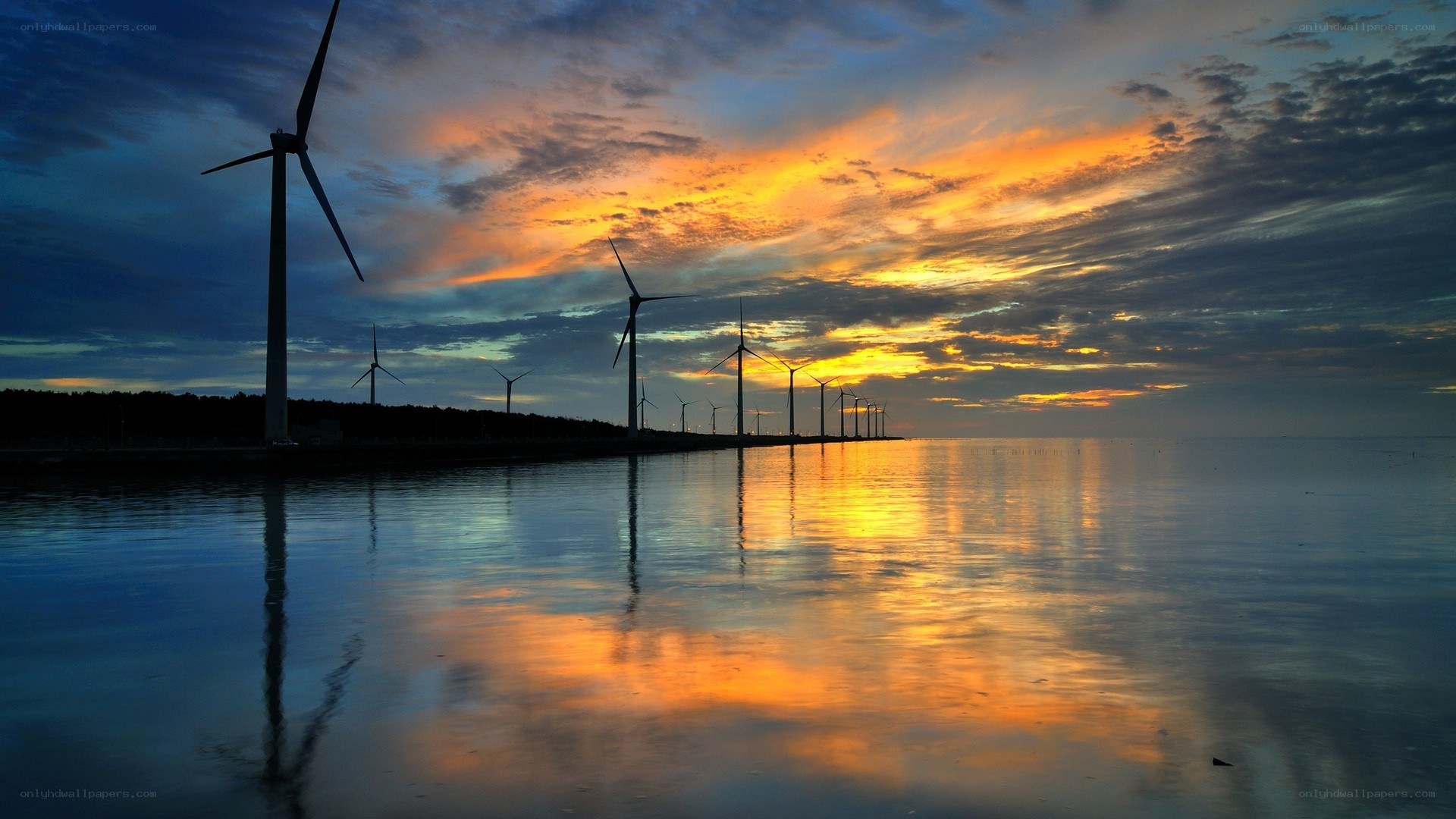 Wind turbines at sunset