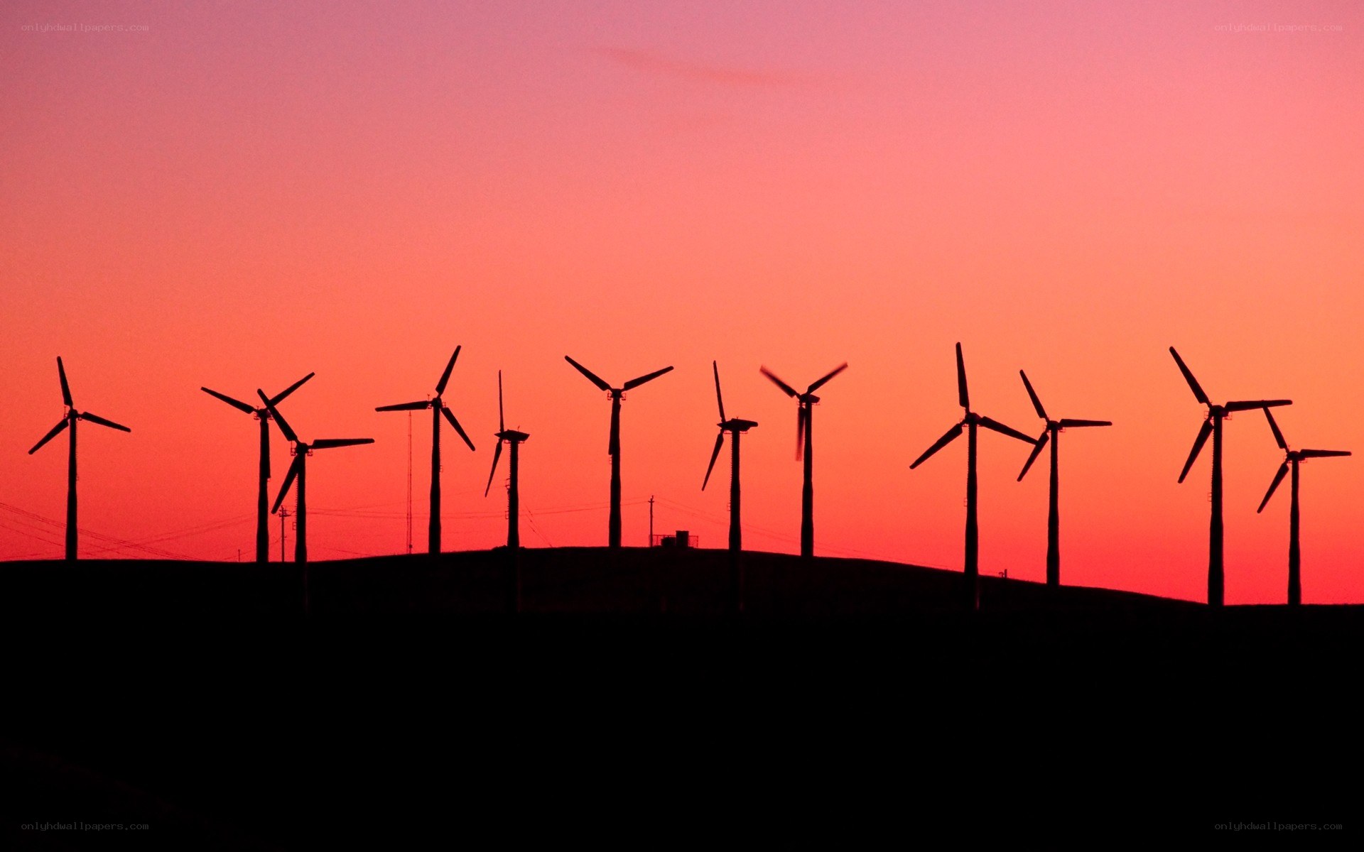 wind turbines at sunset