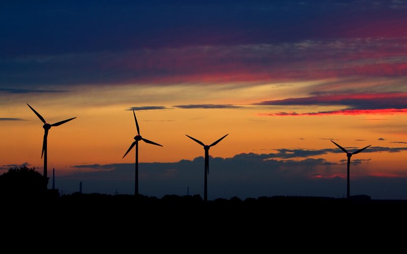 Wind Turbines at Sunset — Orange, Dramatic, Photograph, Clouds, Silhouette
