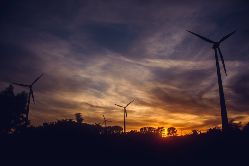 Wind Turbines at Sunset — Orange, Dramatic, Photograph, Clouds, Trees
