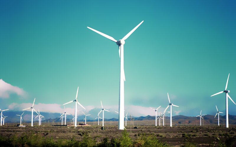 Wind Turbines in Field — Blue, Serene, Afternoon, Photograph, Mountains