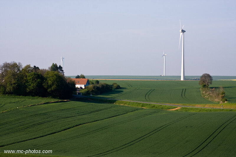 Wind turbines in green fields