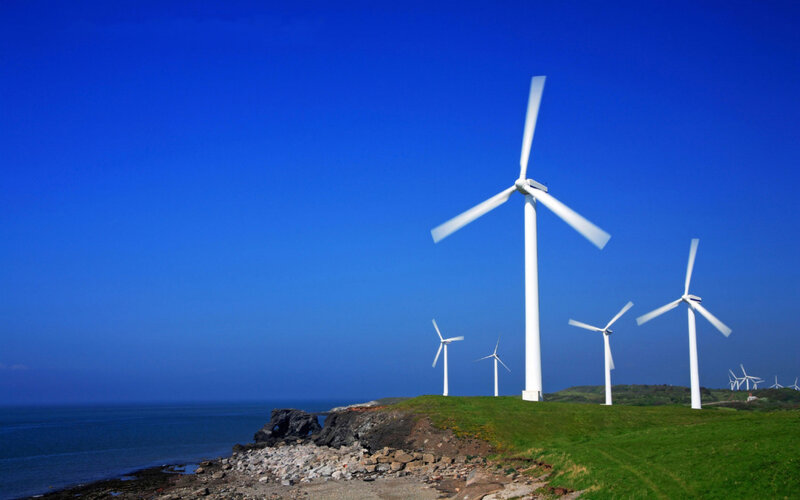 Wind turbines on a coastal hill