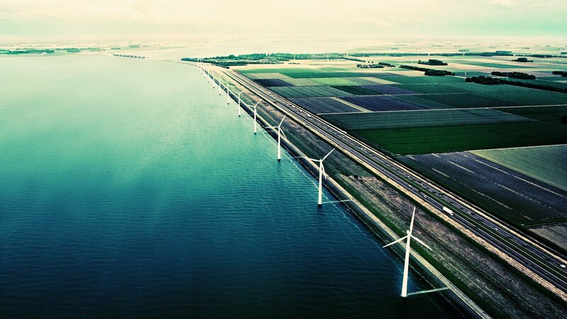 Wind turbines on a coastal road