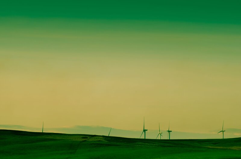Wind turbines on a green hill