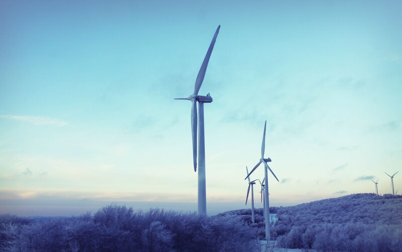 Wind turbines on a snowy hill