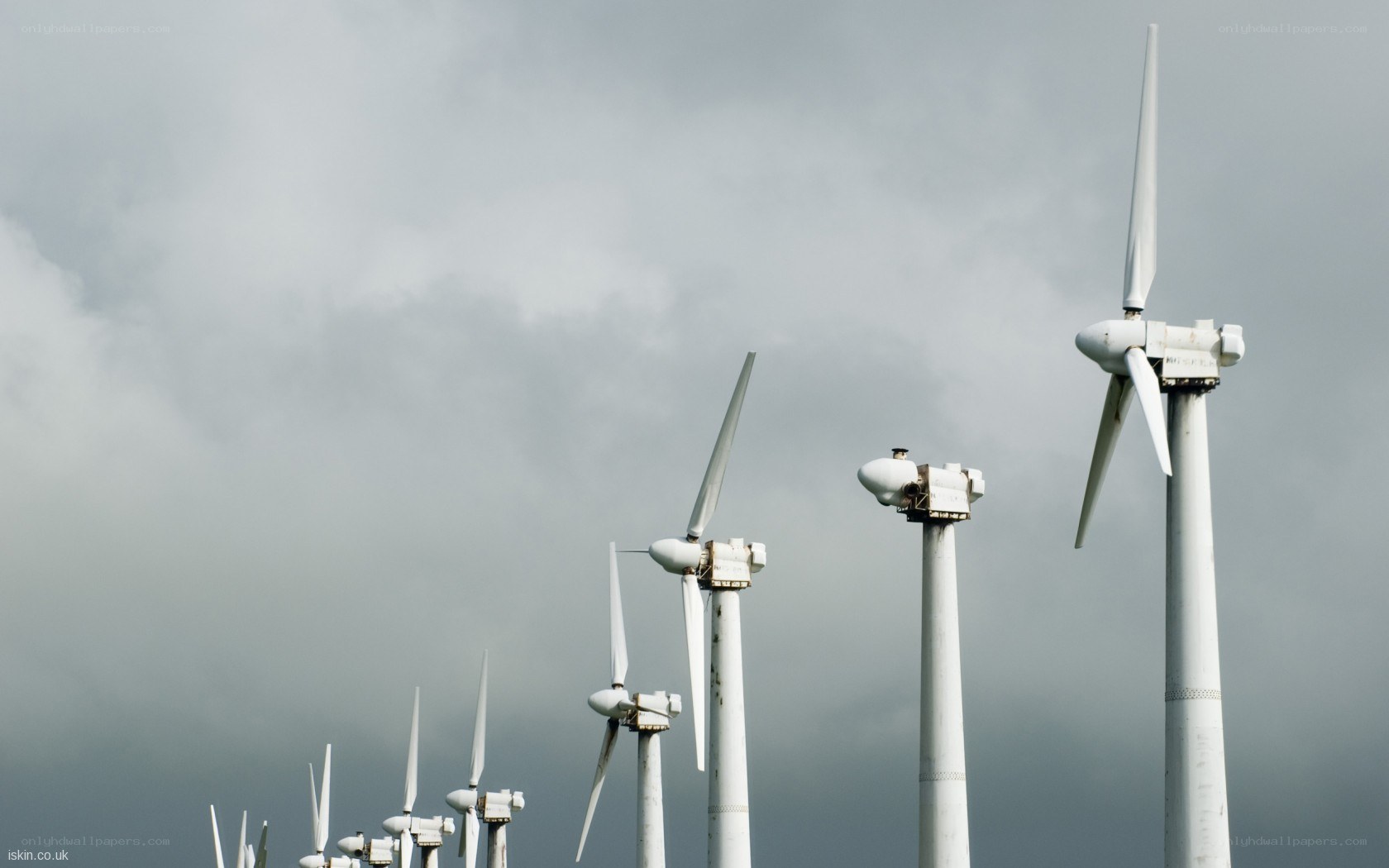 Wind turbines under cloudy sky