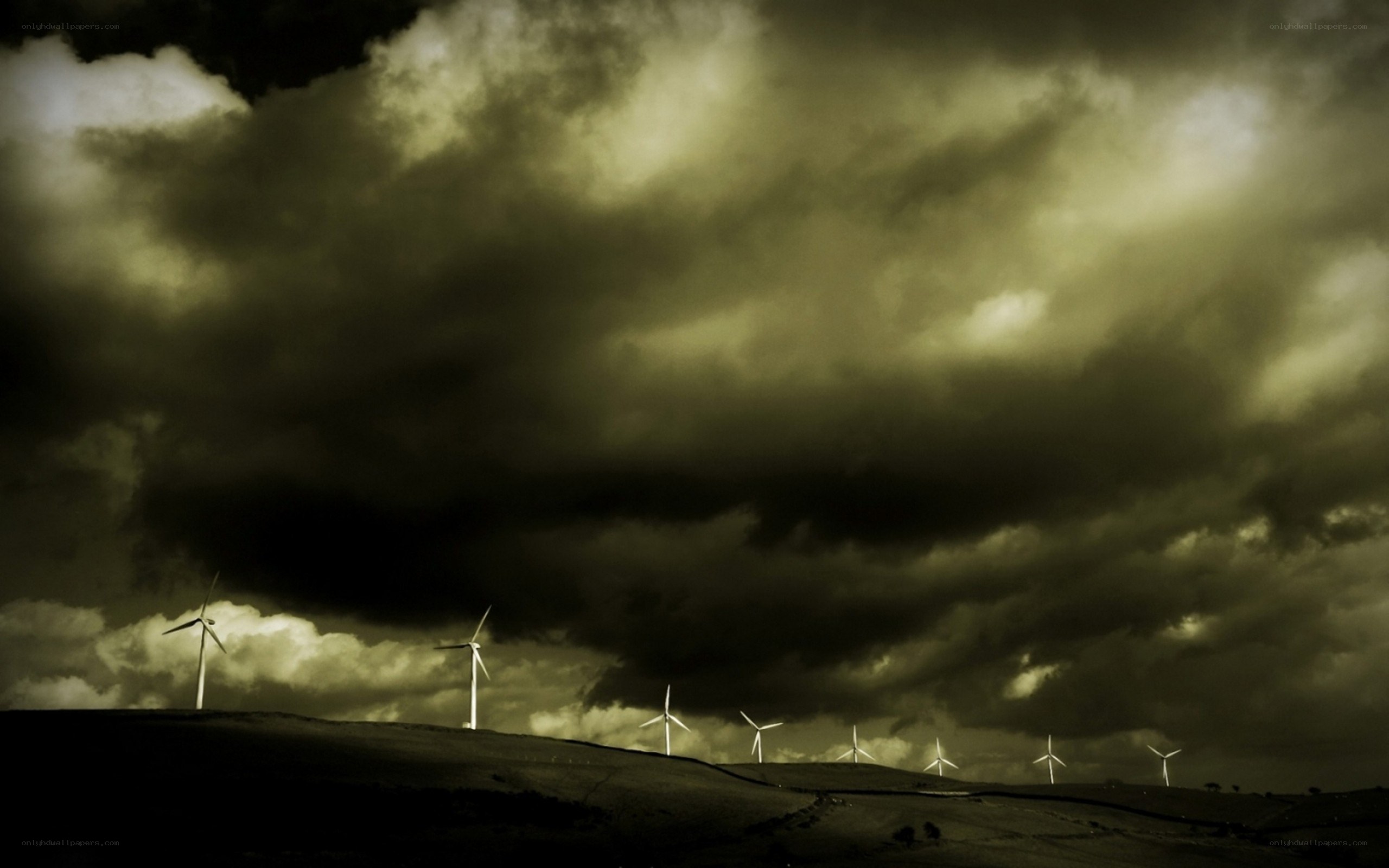Wind turbines under stormy sky
