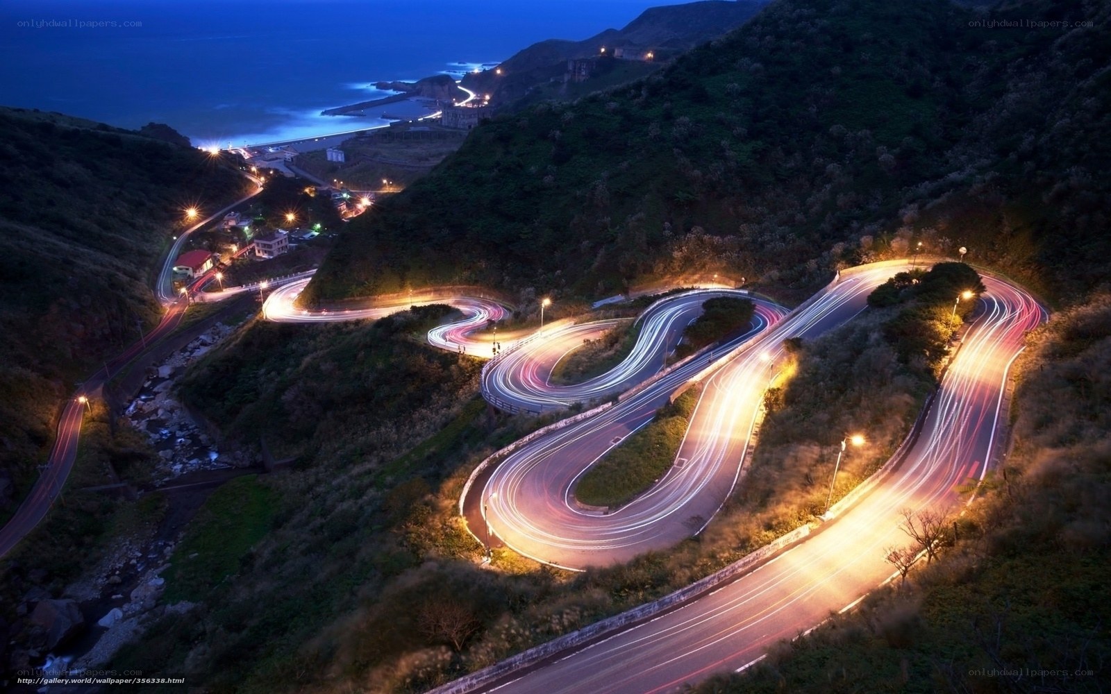 Winding coastal road at night