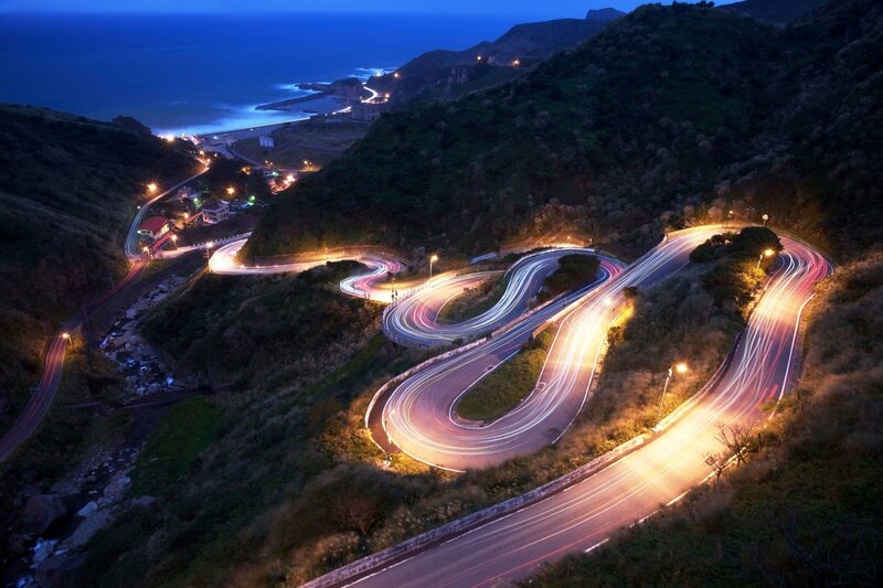 Winding Coastal Road — Blue, Dramatic, Night, Photograph, Mountain, Ocean, Lights, Curves, Black