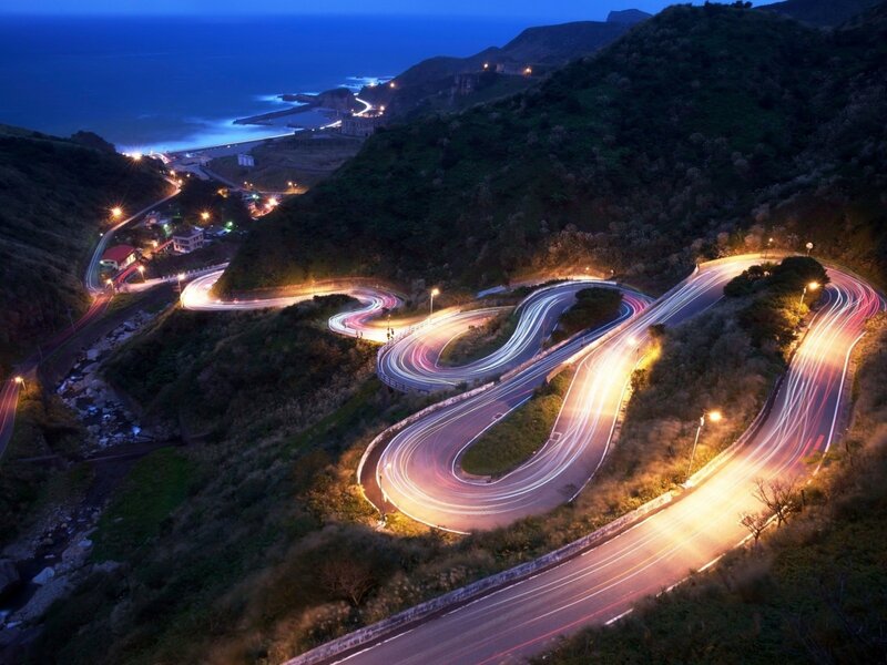 Winding Coastal Road — Blue, Dramatic, Night, Photograph, Mountain, Ocean, Lights