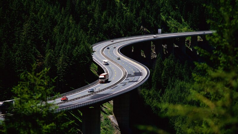 Winding highway through forest