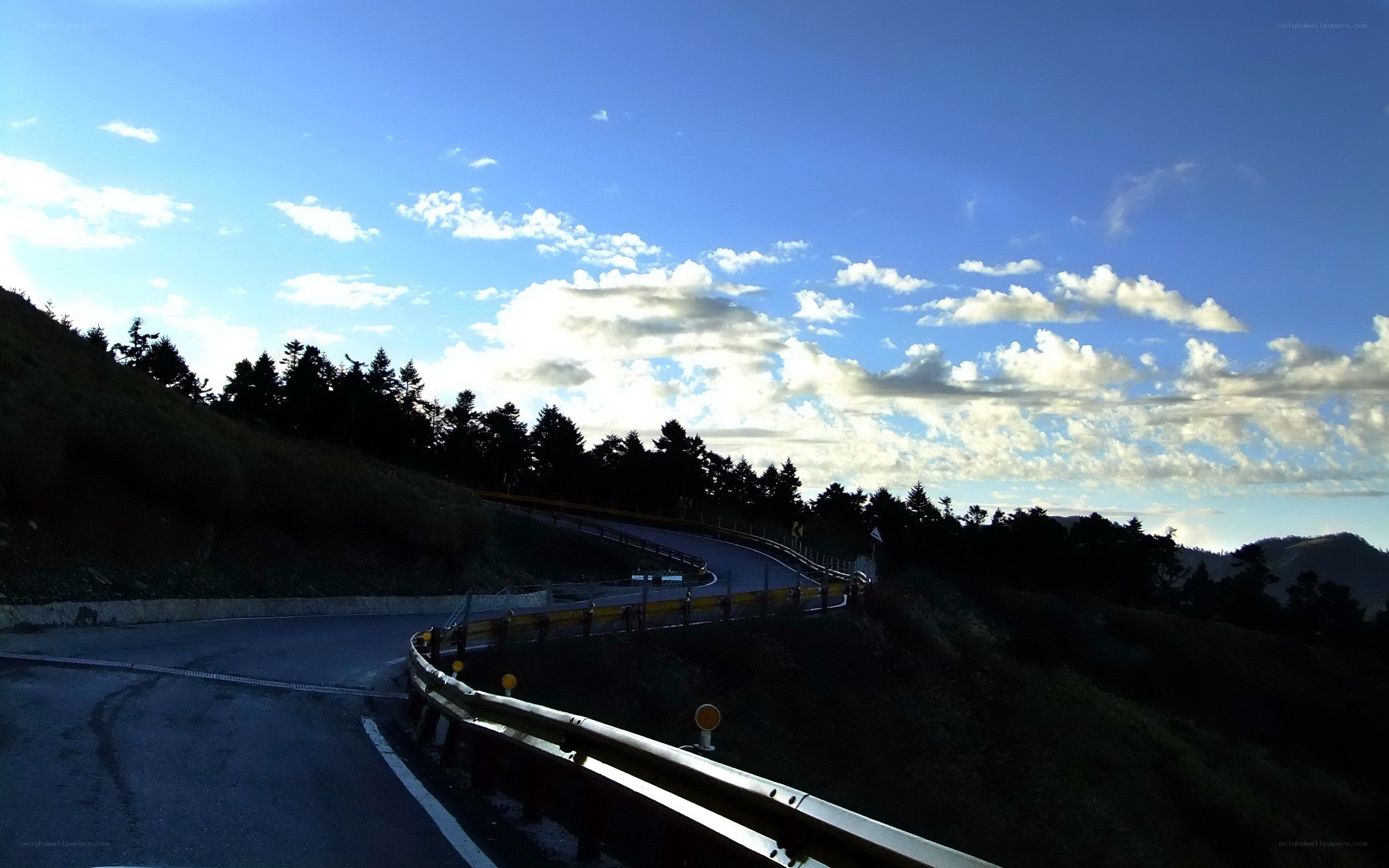 Winding mountain road at dusk