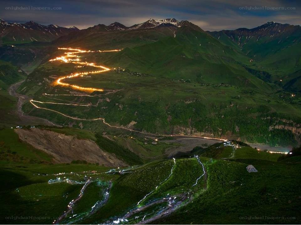 Winding mountain road at night