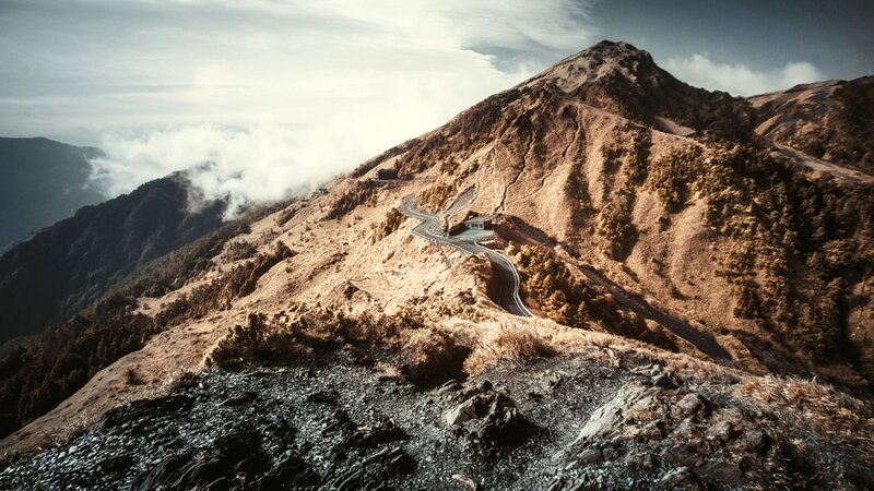 Winding mountain road at sunrise