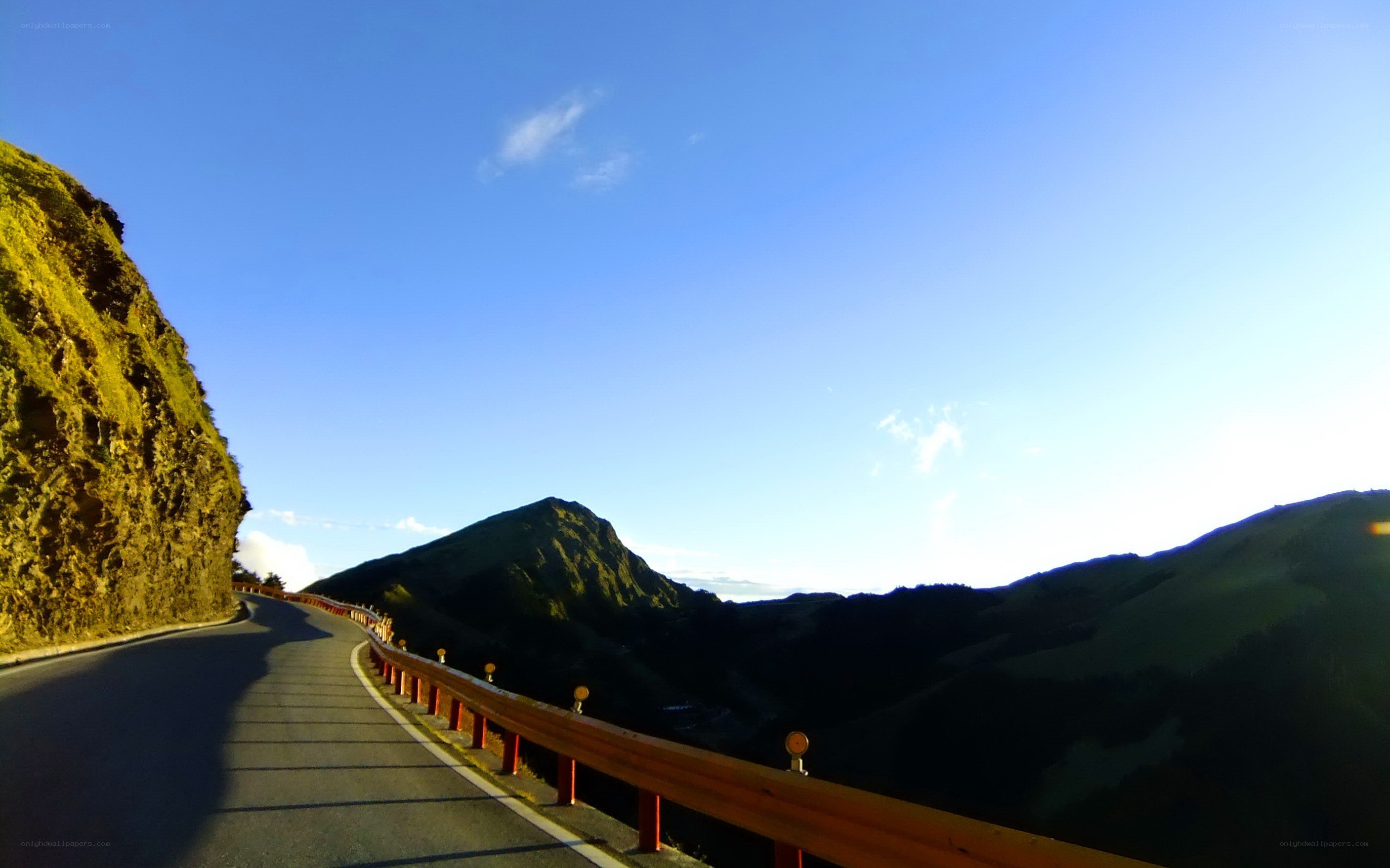 Winding mountain road at sunrise