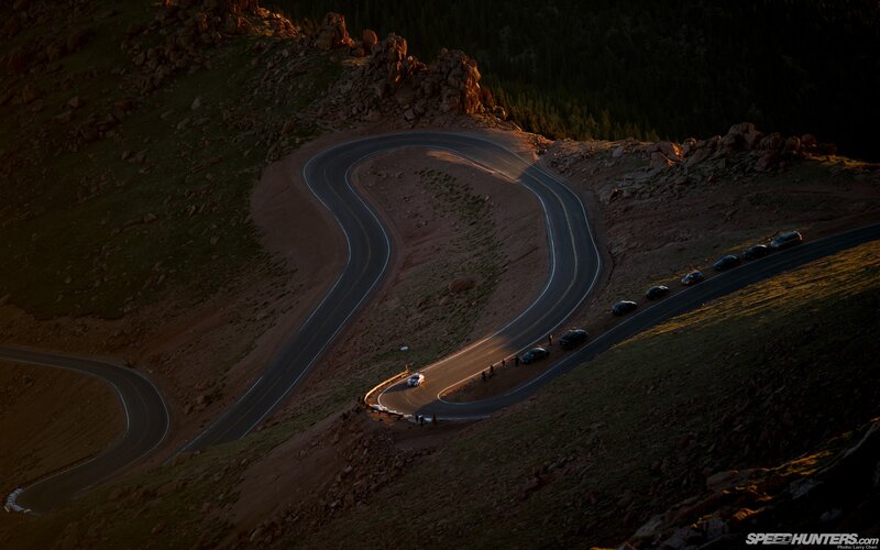 Winding mountain road at sunset