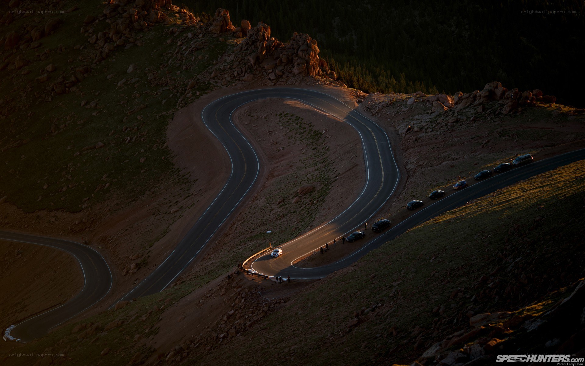 Winding mountain road at sunset