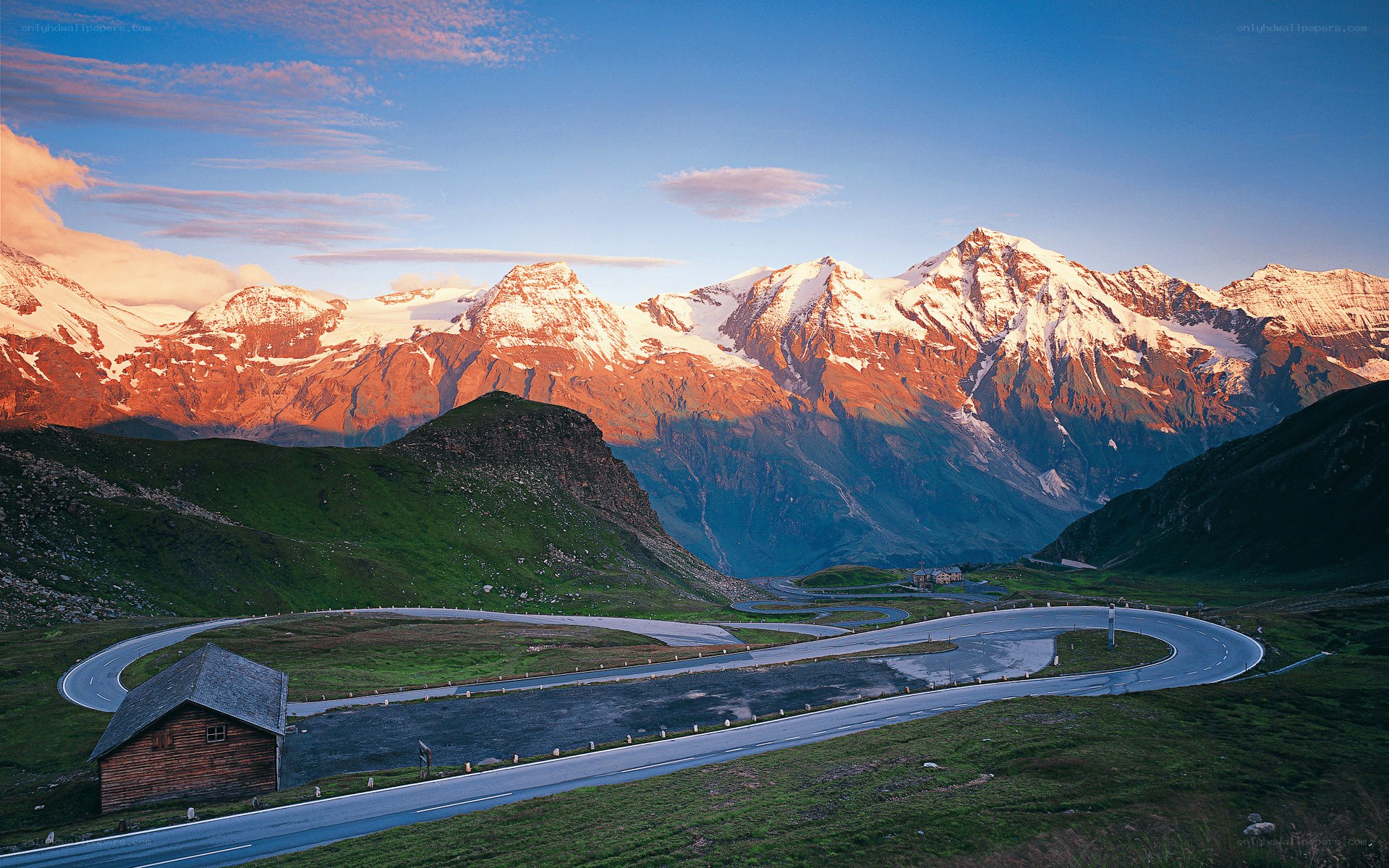 Winding mountain road at sunset