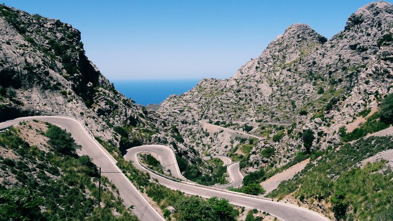 Winding Mountain Road — Blue, Serene, Afternoon, Photograph, Sea