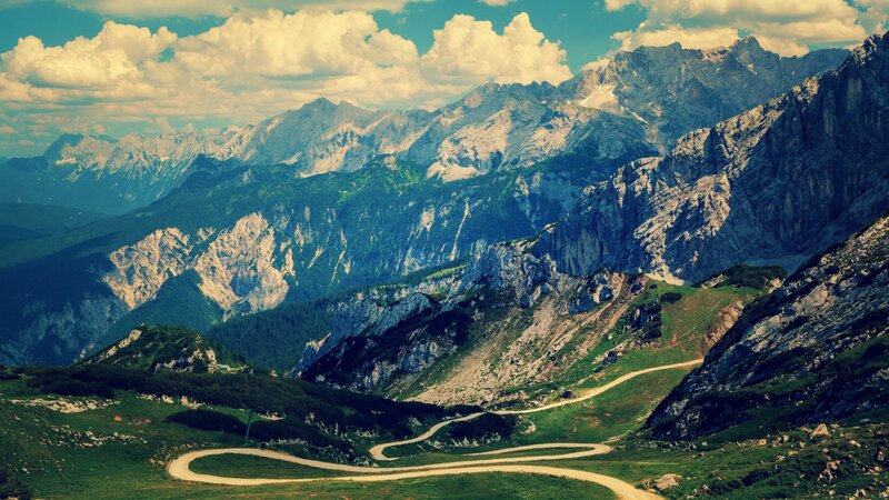 Winding mountain road in alpine landscape