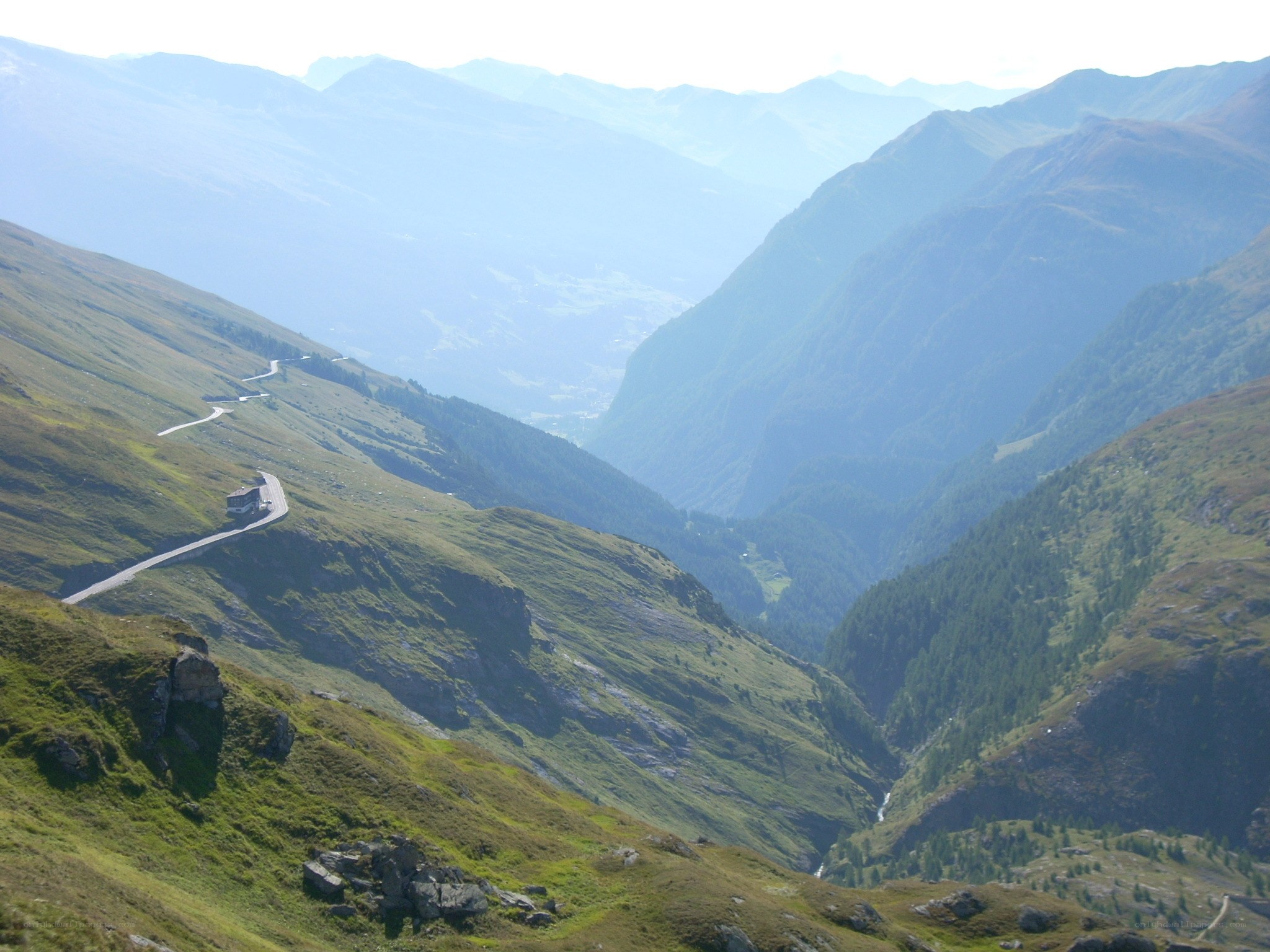 winding mountain road in alpine valley