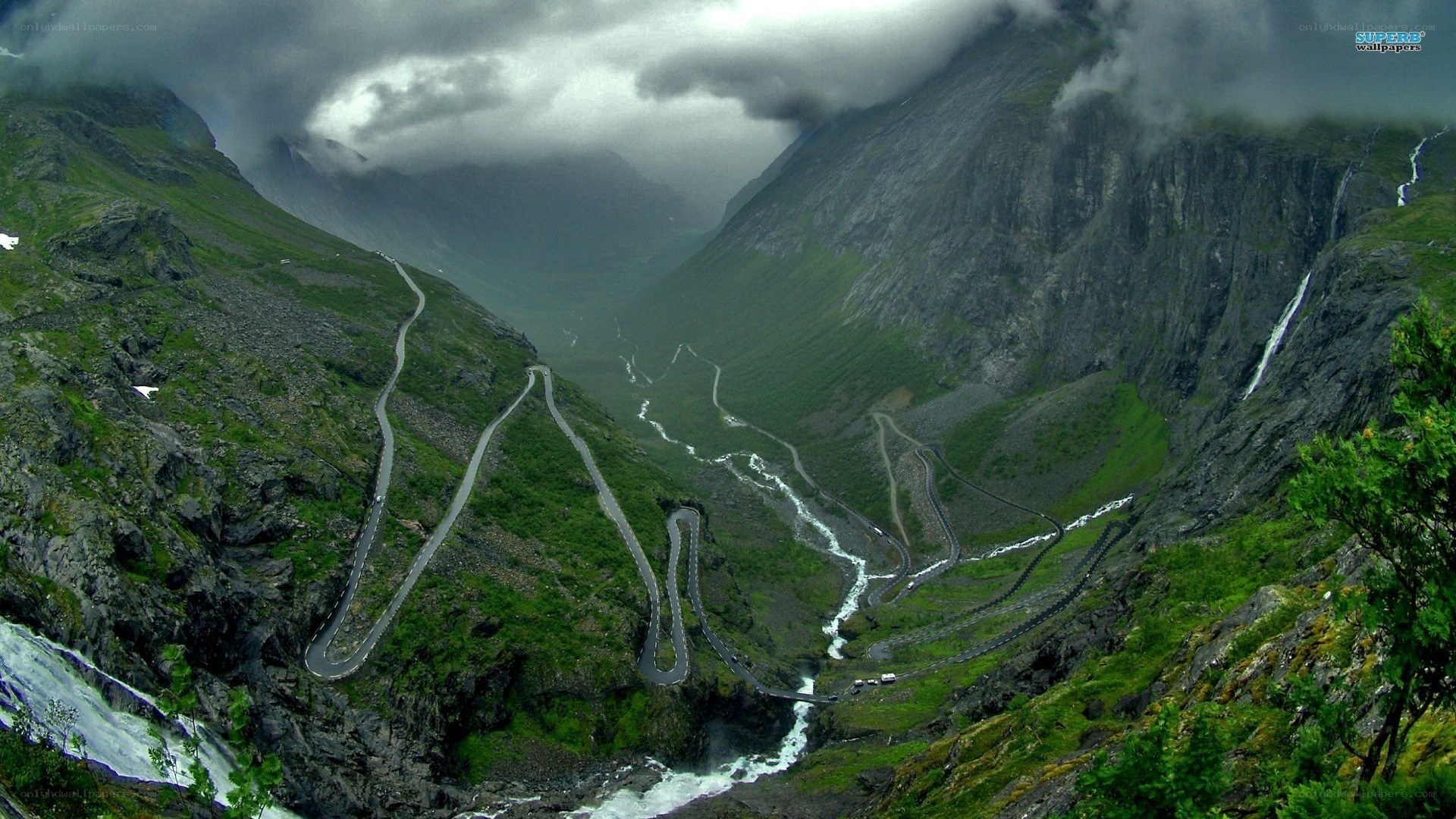 winding mountain road in valley