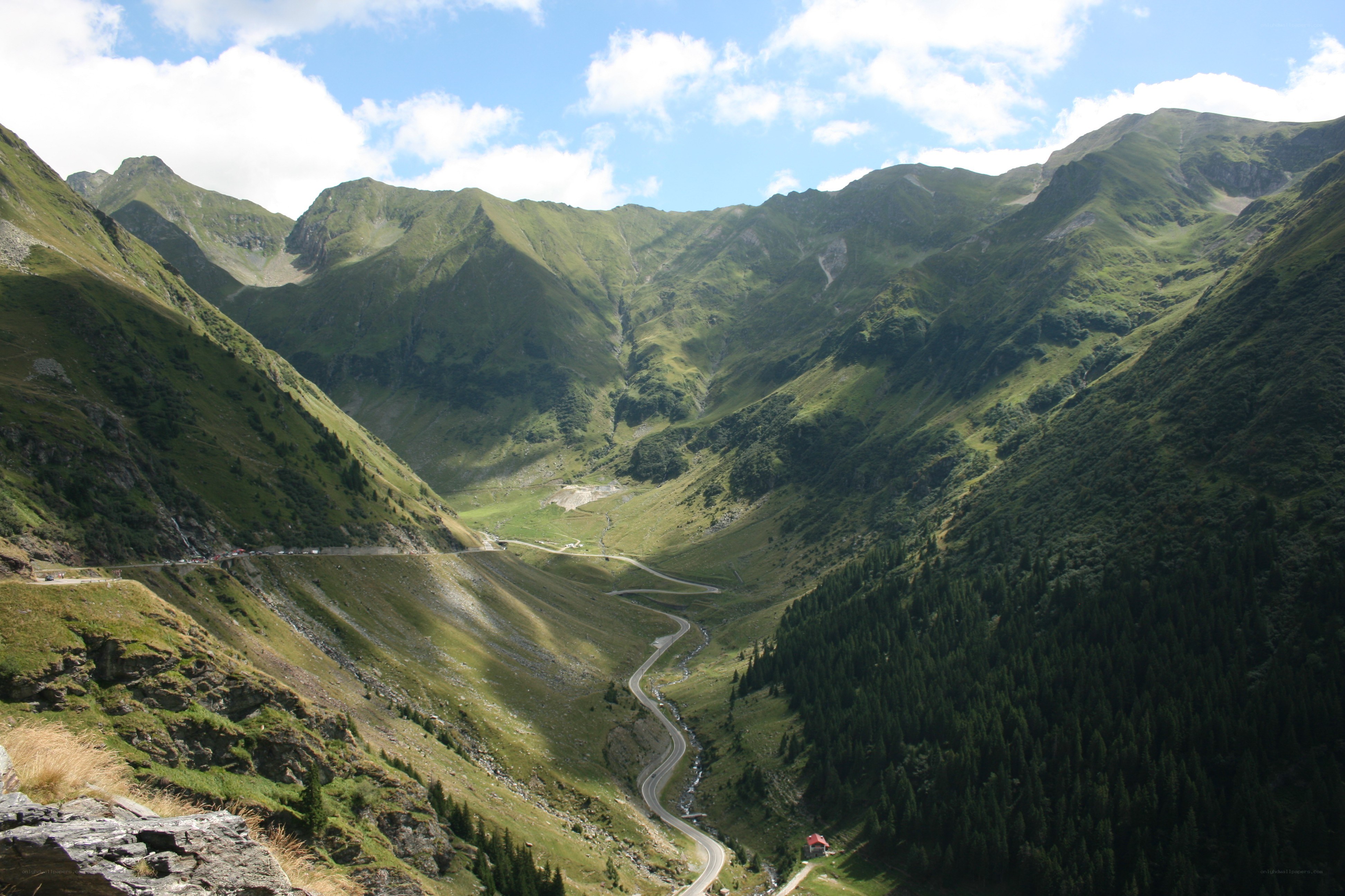 winding mountain road in valley