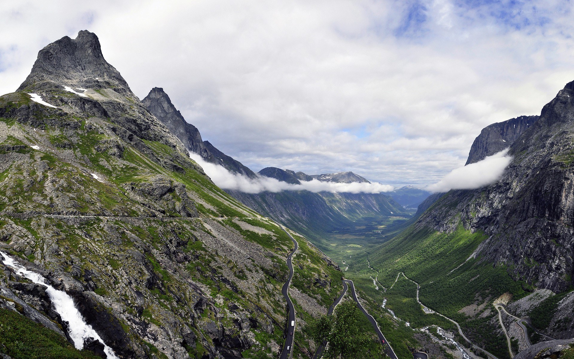 winding mountain road in valley