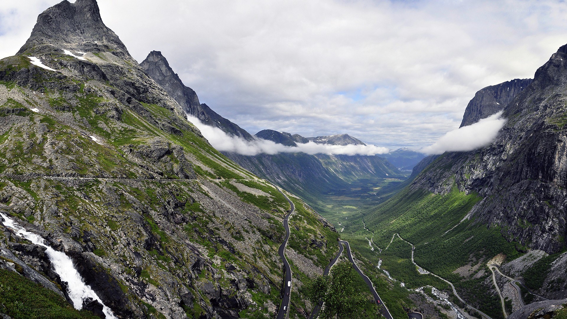 winding mountain road in valley