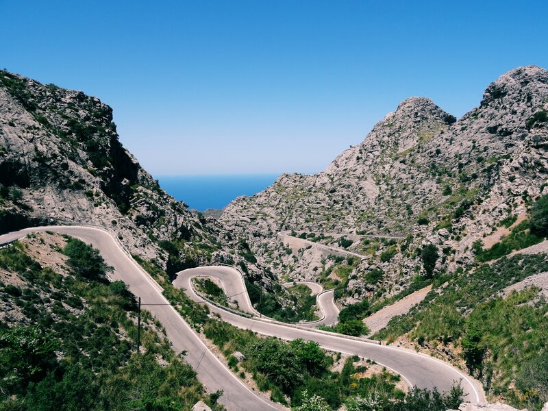 Winding mountain road to the sea