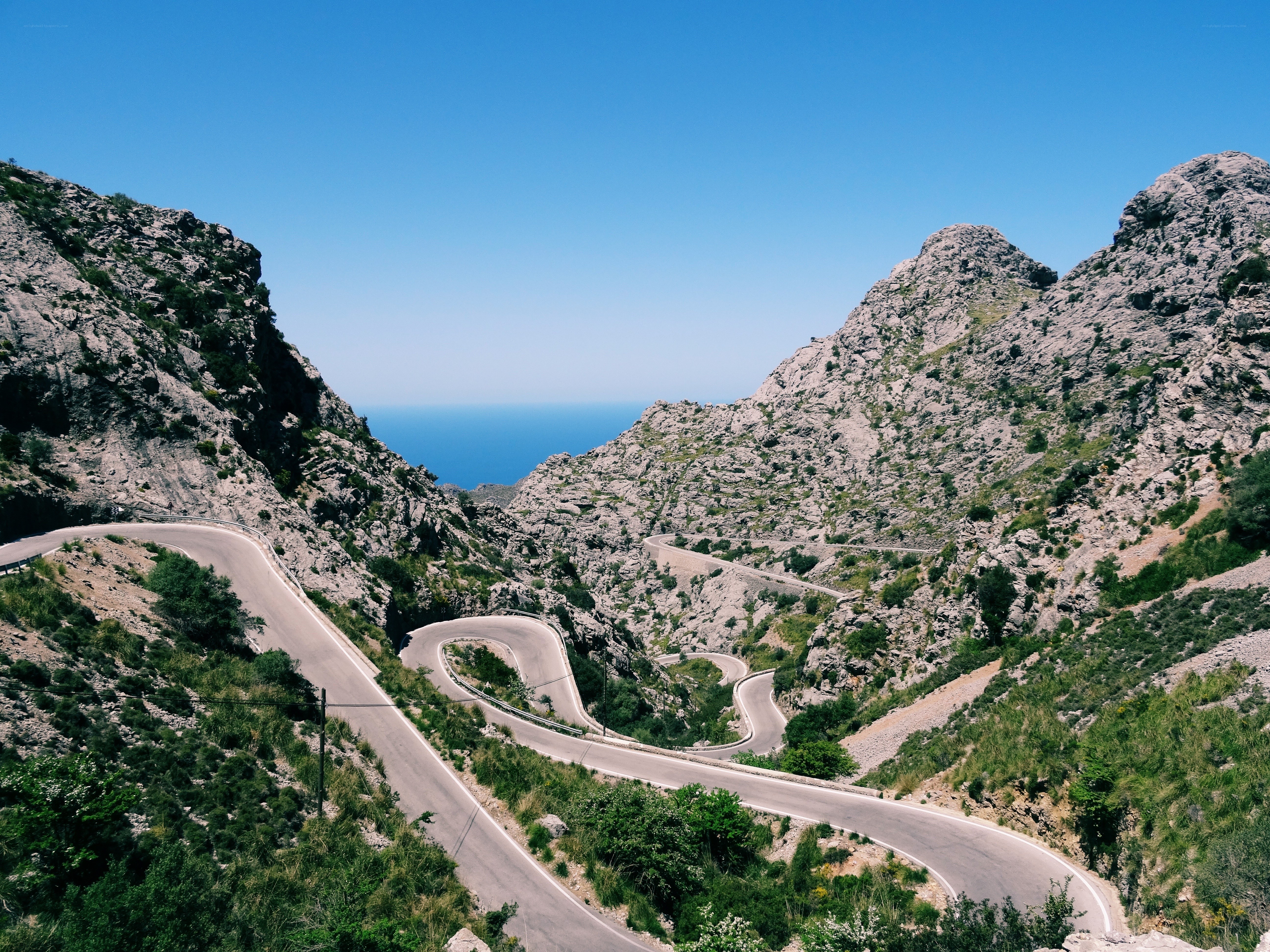 Winding mountain road to the sea
