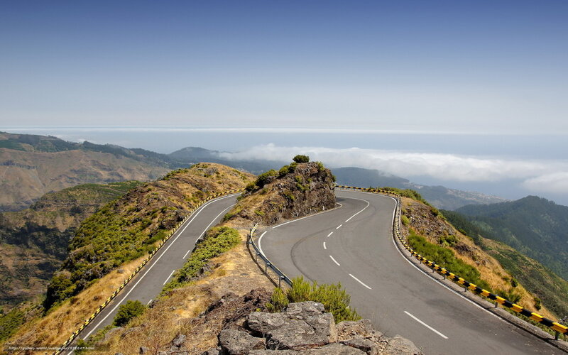 Winding mountain road with ocean view