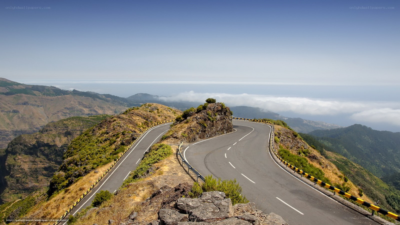 Winding mountain road with ocean view