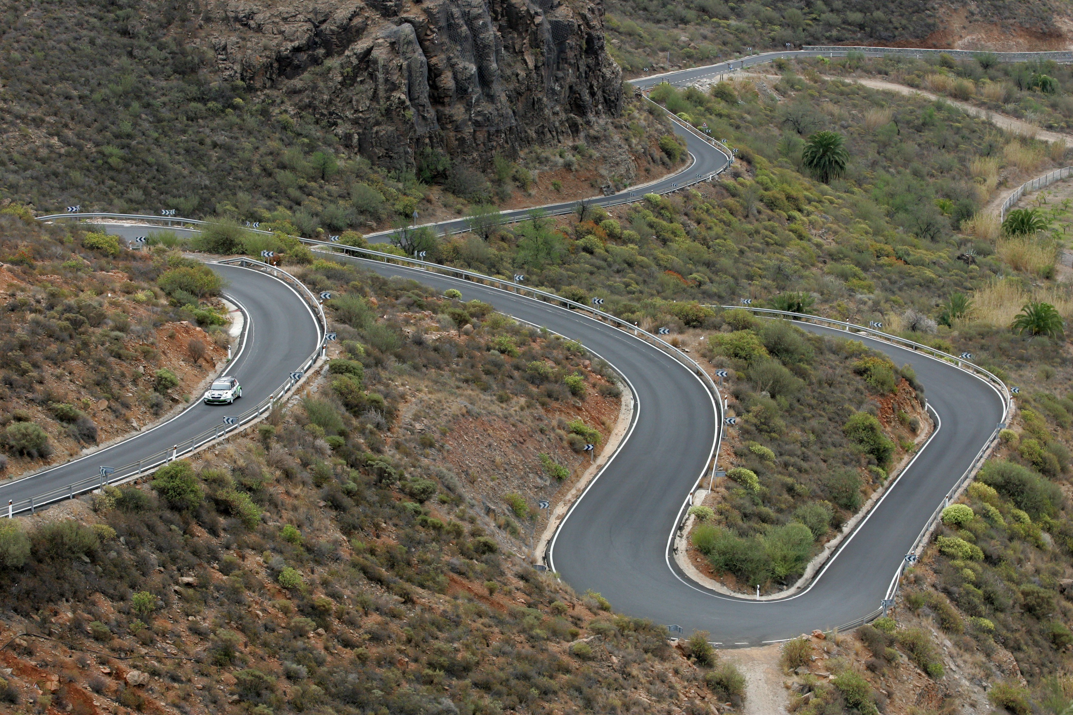 Winding mountain road with rally car