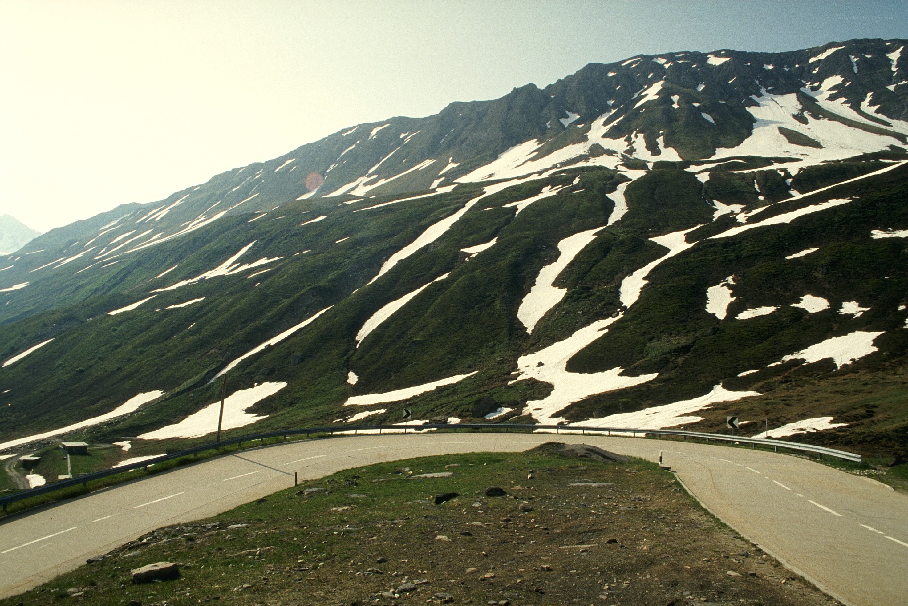 winding mountain road with snow