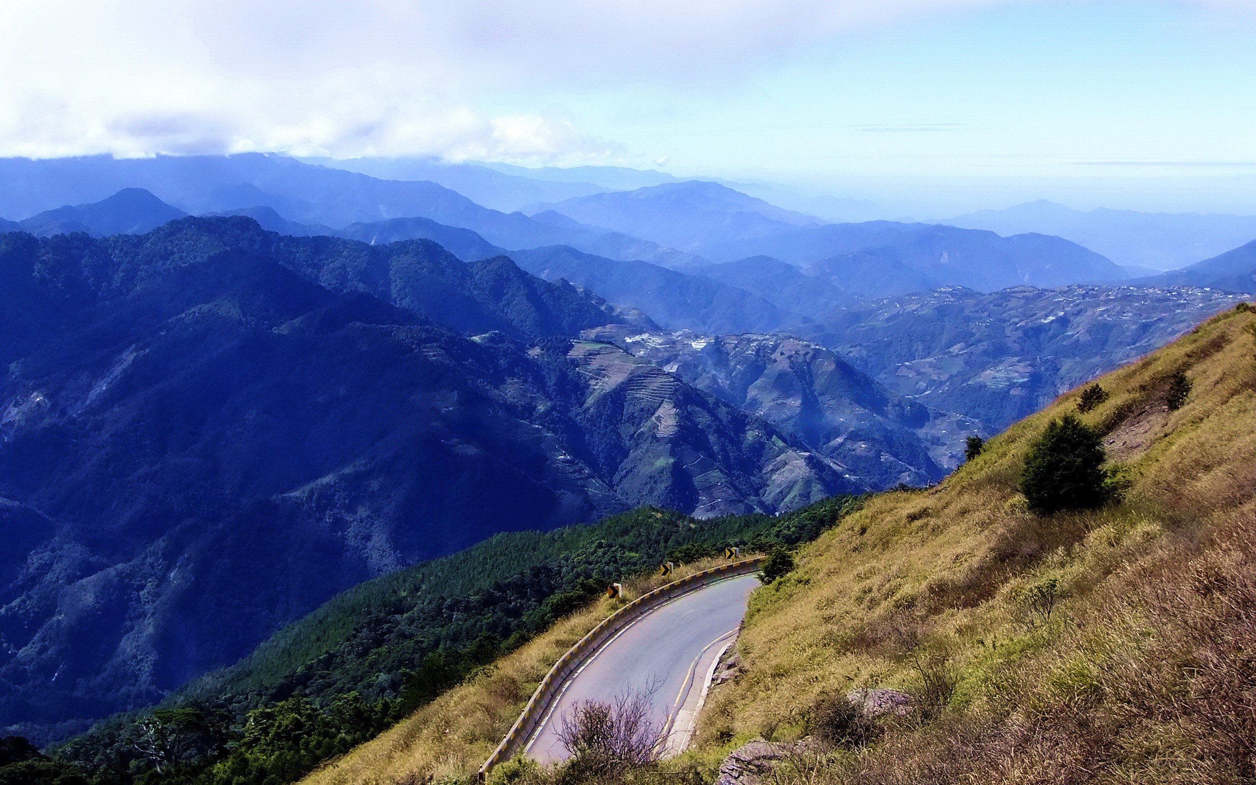 Winding mountain road with valley view