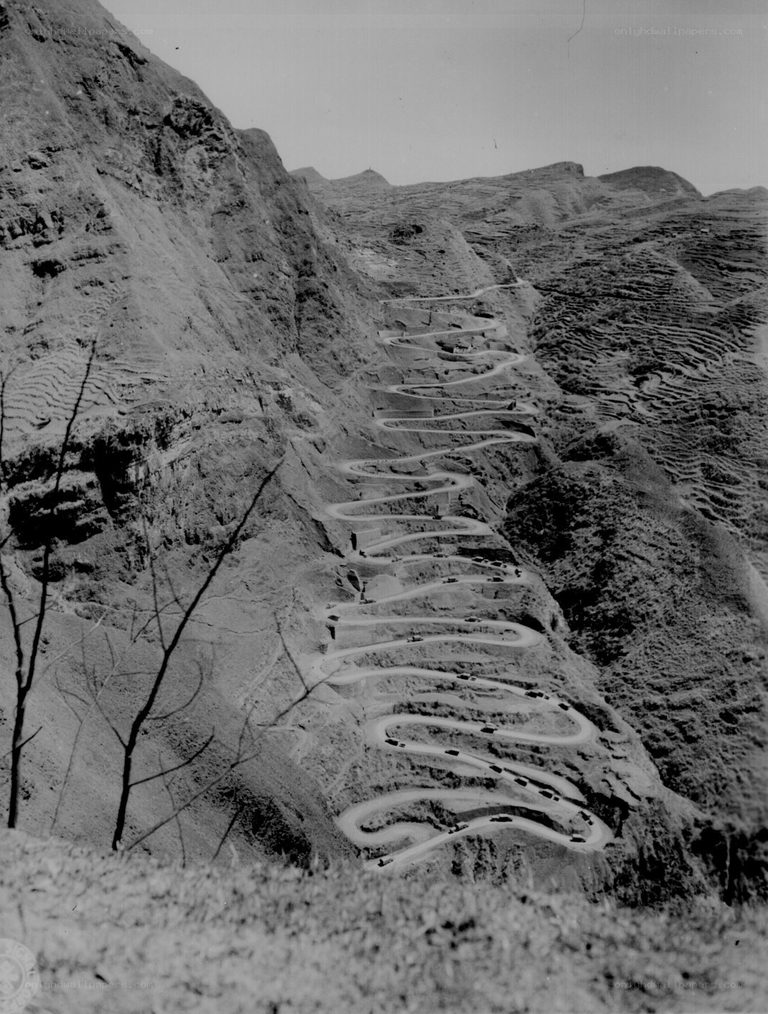 Winding mountain road with vehicles