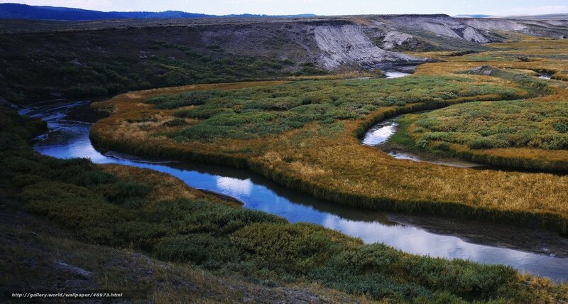 Winding river through grasslands