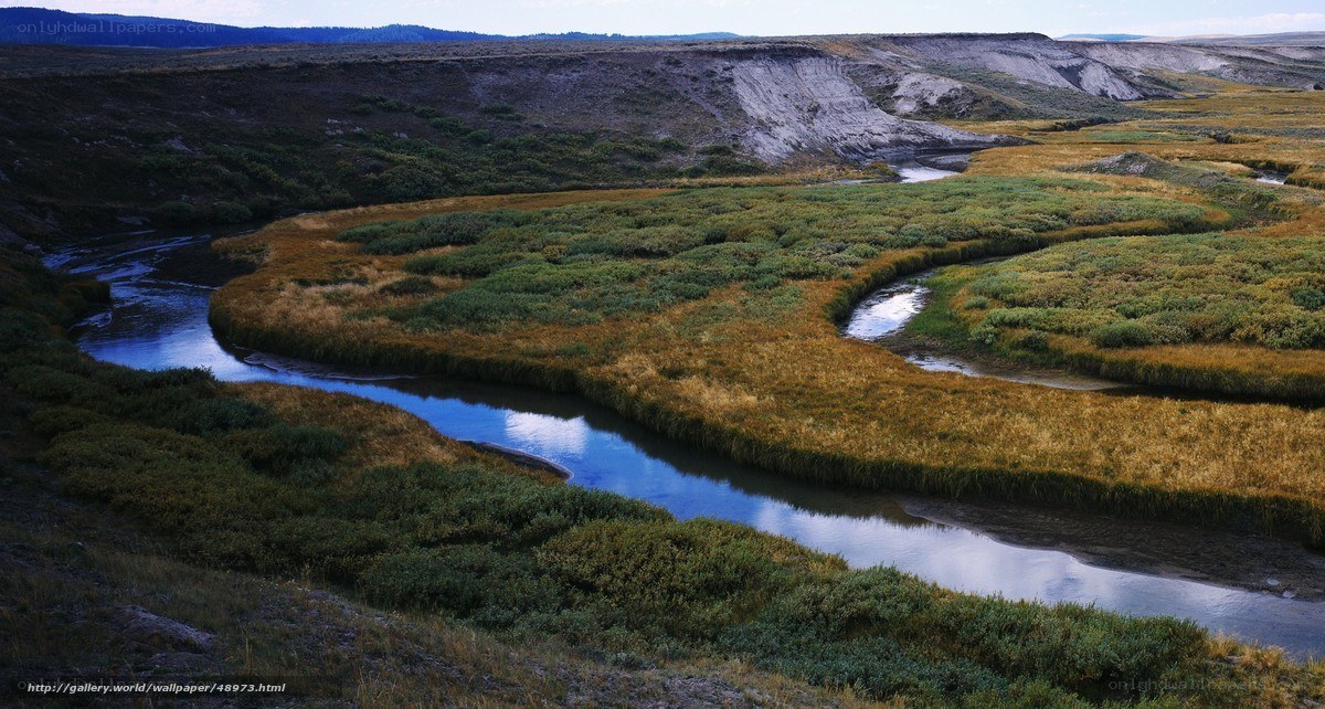 Winding river through grasslands
