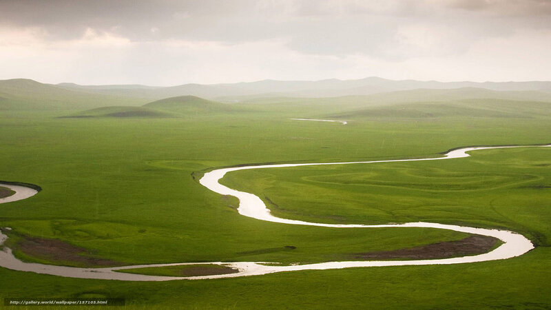 Winding river through green plains